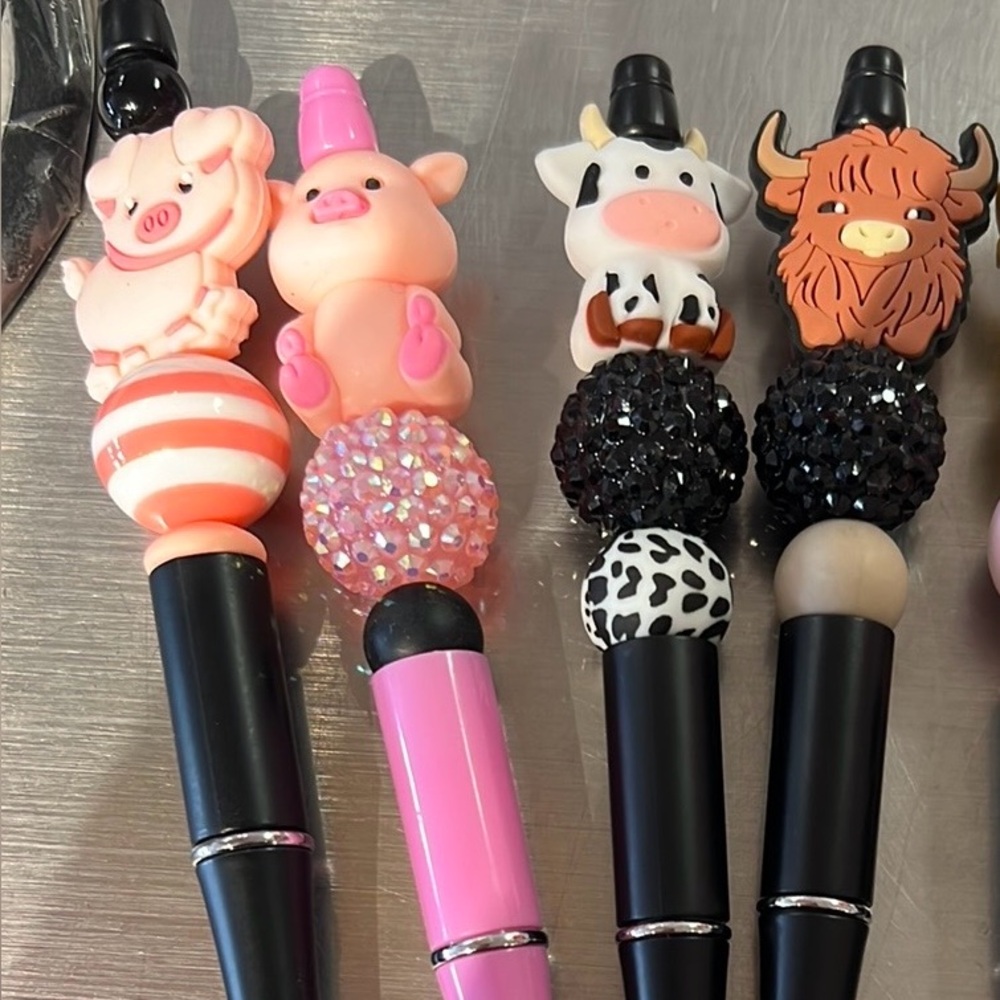 Animal-Themed Black and Pink Pens